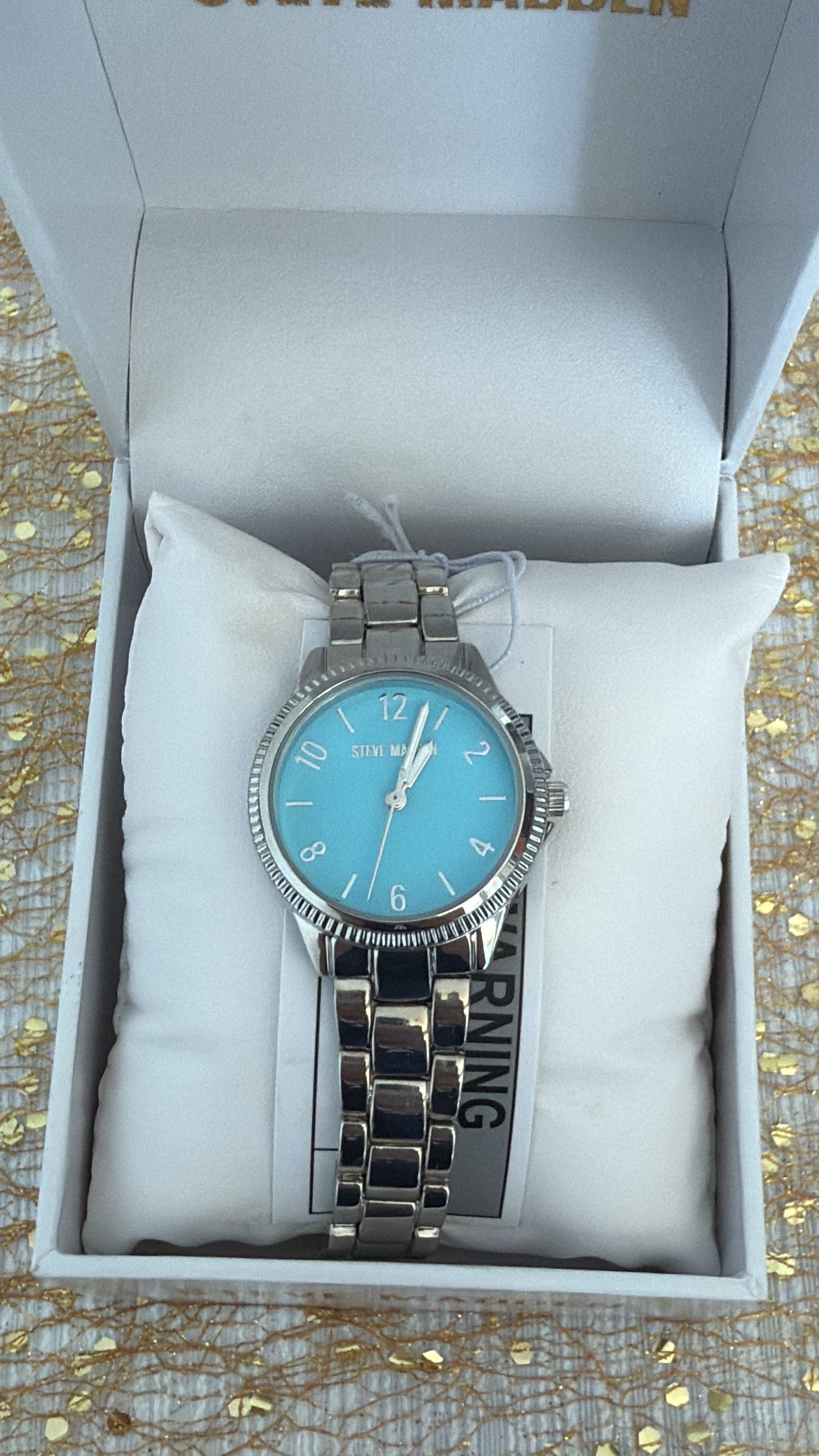 RELOJ STEVE MADDEN MUJER SILVER FONDO CELESTE