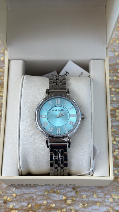 RELOJ NINE WEST MUJER SILVER FONDO CELESTE